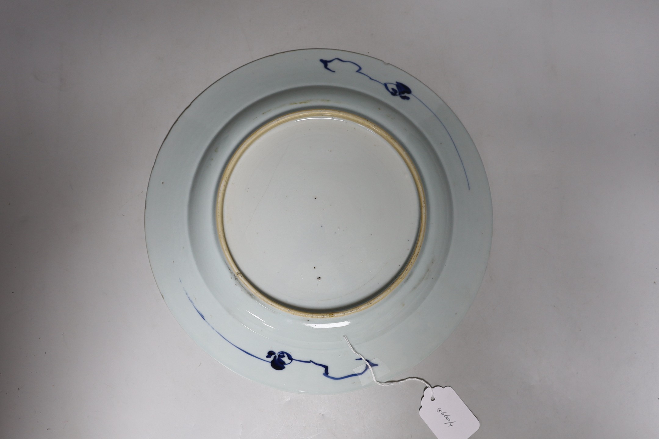 A Chinese blue and white landscape dish, Qianlong period 31cm diameter, together with a similar pair of tea bowls and saucers